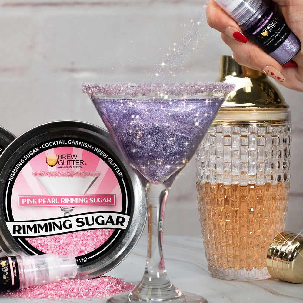 purple drink glitter sprayed into martini glass