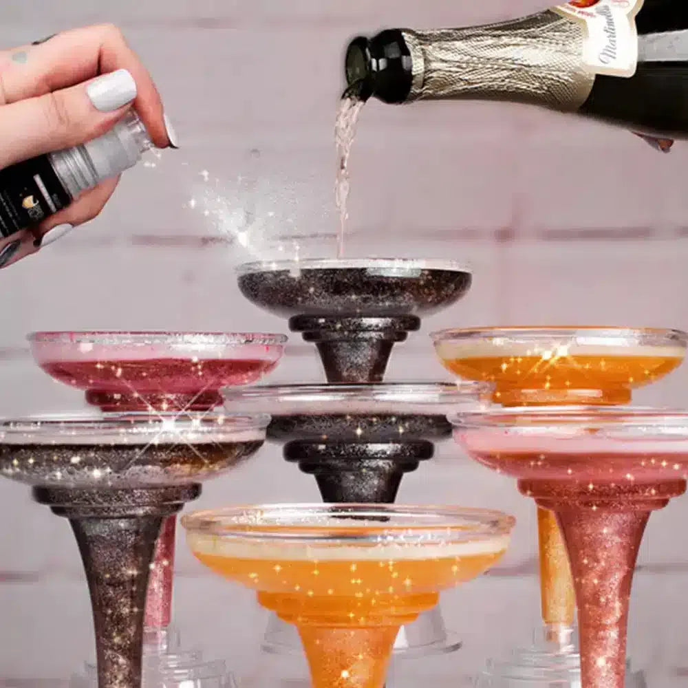edible glitter spray on champagne glasses