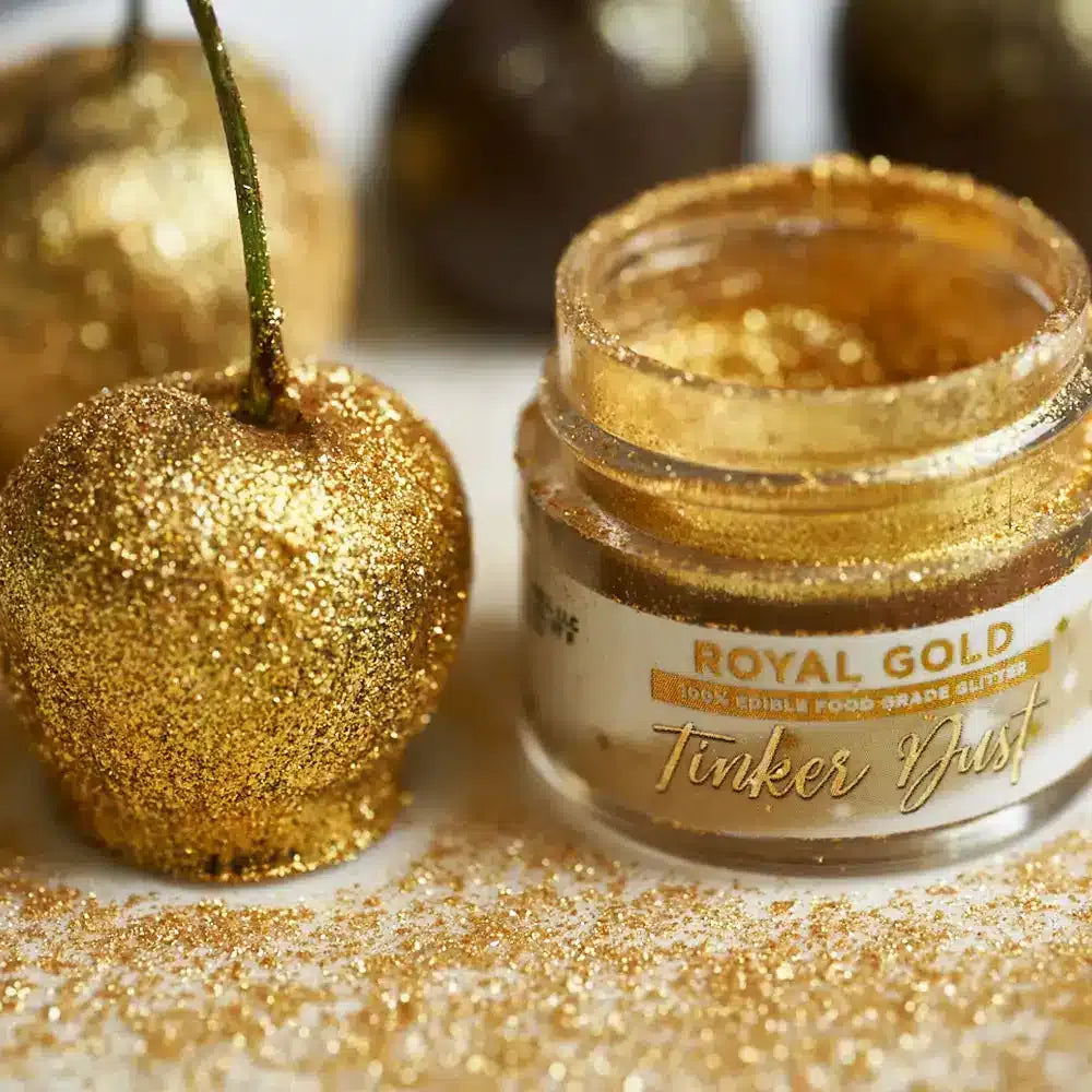fruit coated in gold edible glitter with a tinker dust jar