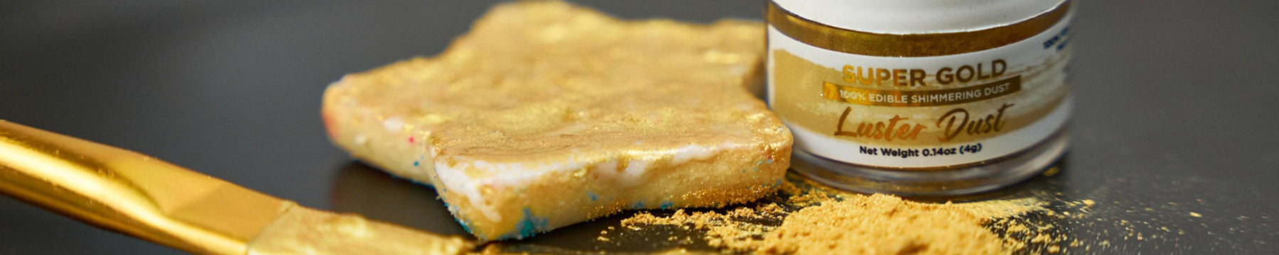 Gold luster dust and a brush next to a gold-dusted cookie, ready for edible decorations.