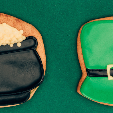 St. Patrick's Day cookies: green shamrock, black pot of gold, green leprechaun hat, and white horseshoe.