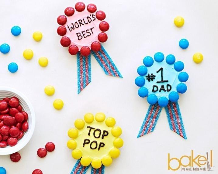 Colorful "World's Best," "#1 Dad," and "Top Pop" candy medals with striped ribbons.