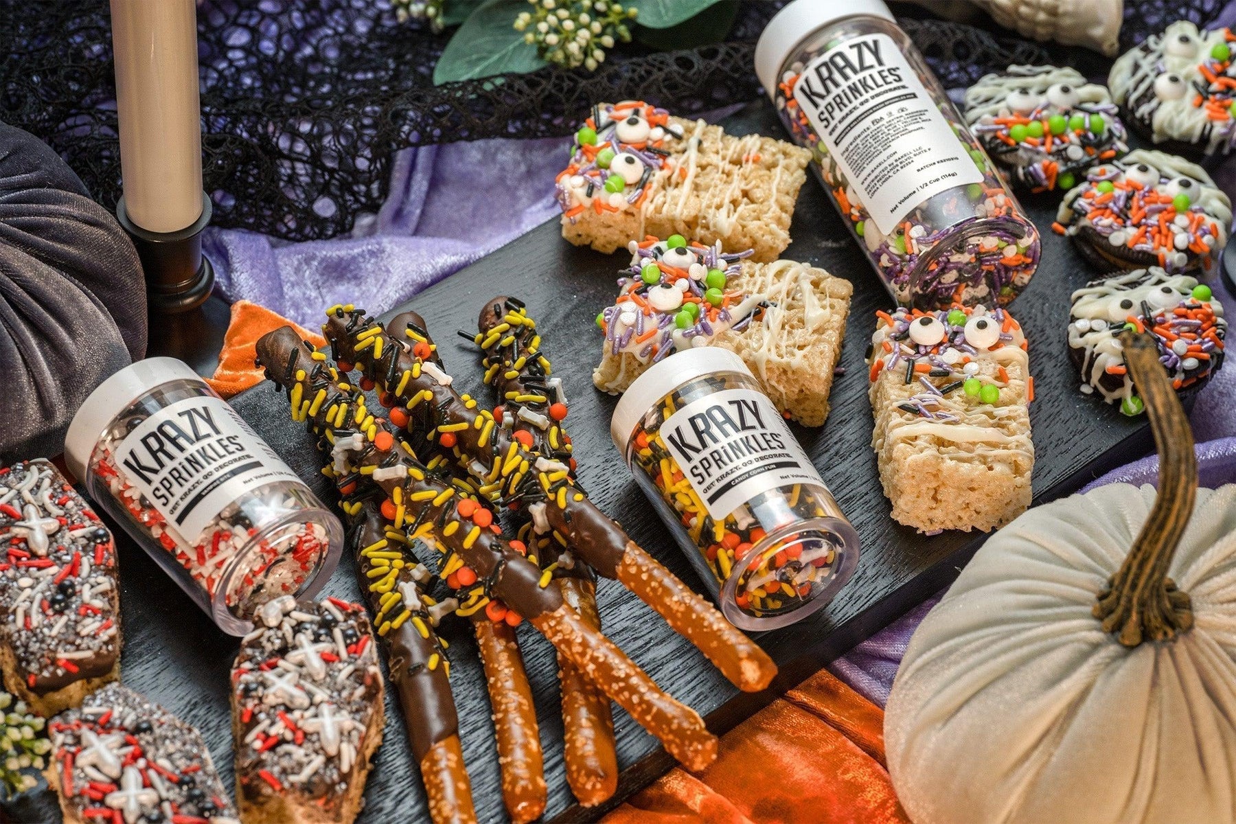 Halloween treats: chocolate-dipped pretzels, rice crispy monsters, and cookies with Krazy Sprinkles.