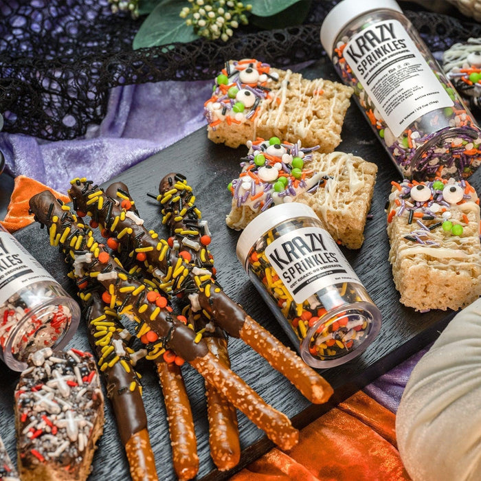 Halloween treats: chocolate-dipped pretzels, rice crispy monsters, and cookies with Krazy Sprinkles.