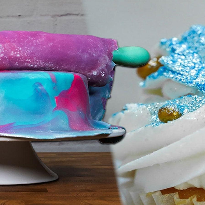 Left: A vibrant galaxy-themed cake with purple, blue, and pink icing. Right: A cupcake with white frosting, blue glitter, and gold sprinkles.