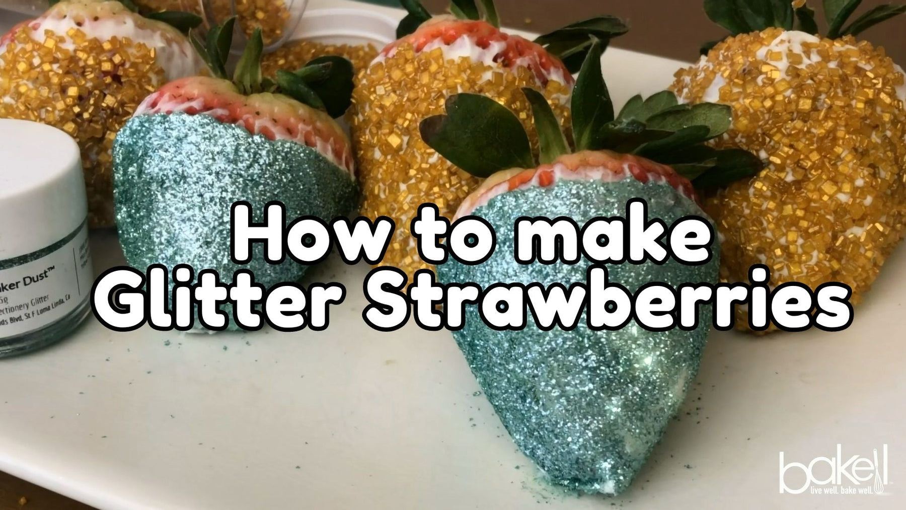 shot of plated glitter strawberries in gold and blue