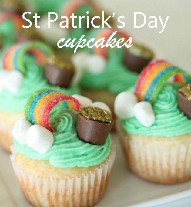 St. Patrick's Day cupcakes with green frosting, rainbow candy, mini marshmallows, and chocolate pots of gold.