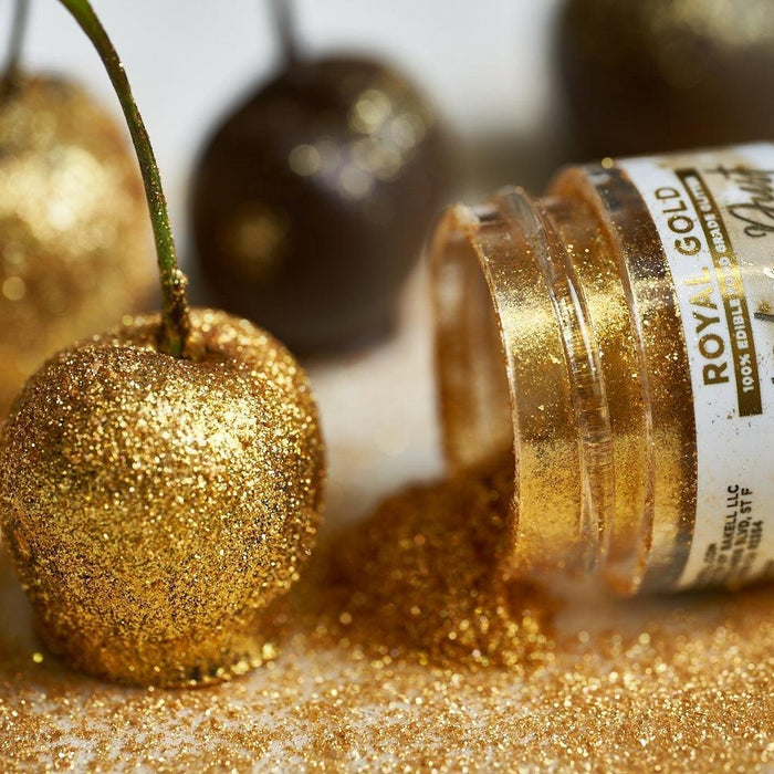 Gold glitter-covered cherry next to an open jar of "Royal Gold" edible glitter.
