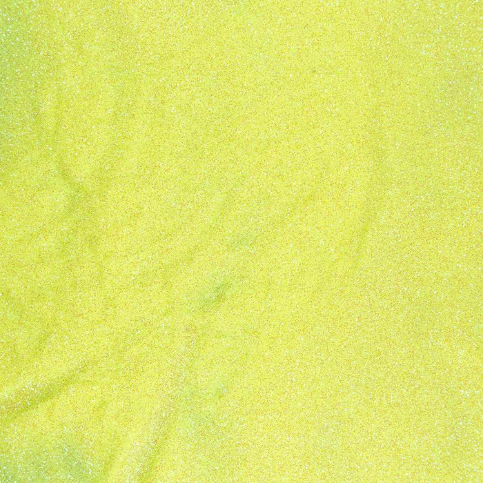 Close-up of baby yellow ultrafine UV reactive iridescent polyester craft glitter.