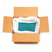 Open cardboard box with a large bag of Bermuda Blue-Green ultrafine metallic craft glitter.