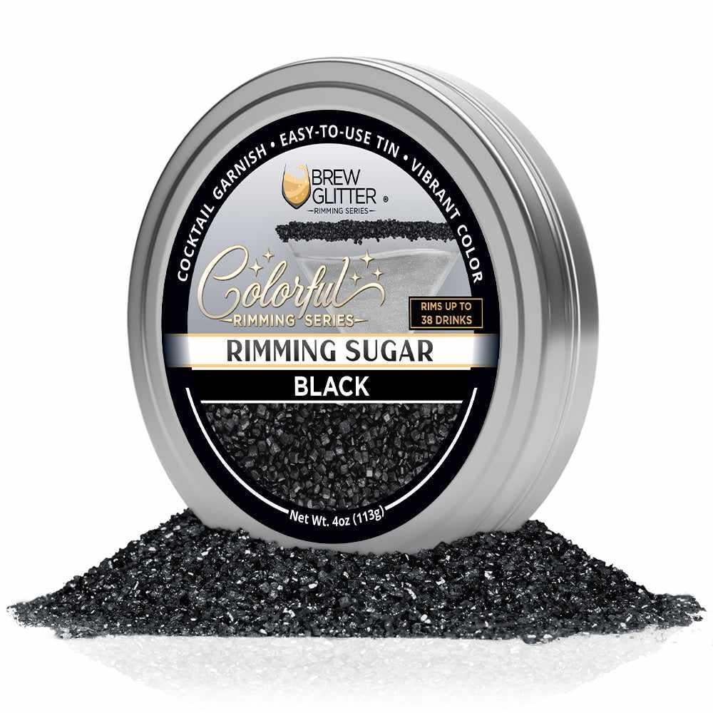 4oz tin of black cocktail rimming sugar with a branded label, surrounded by a pile of coarse black sugar crystals.