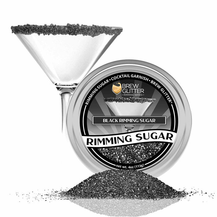 Black rimming sugar in a tin with a martini glass rimmed with black sugar.