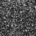 Close-up of sparkling black rimming sugar crystals for cocktail garnishes.