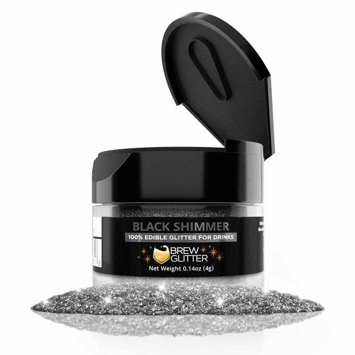 4g jar of Black Shimmer edible drink glitter with a flip-top lid and a pile of sparkling black glitter in front.