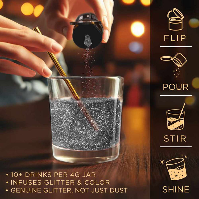 Hand pouring black shimmer edible glitter into a glass of water with a gold stirring straw.