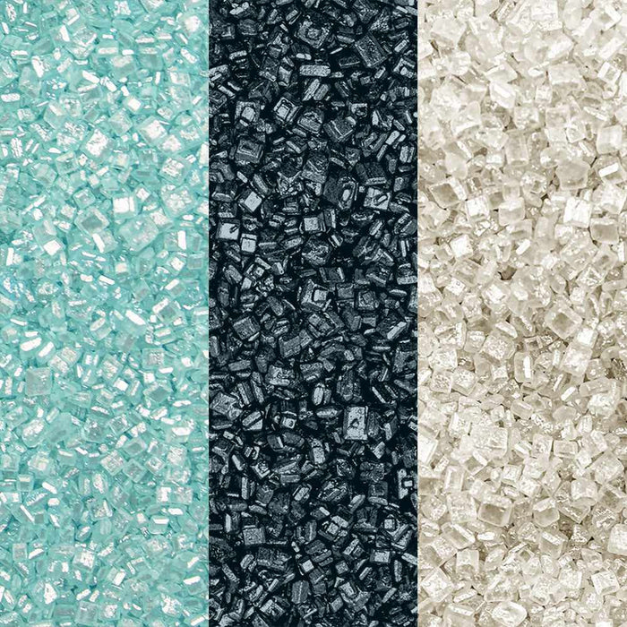 Close-up of three vertical sections of sparkling cocktail rimming sugar: light blue, dark grey, and white.