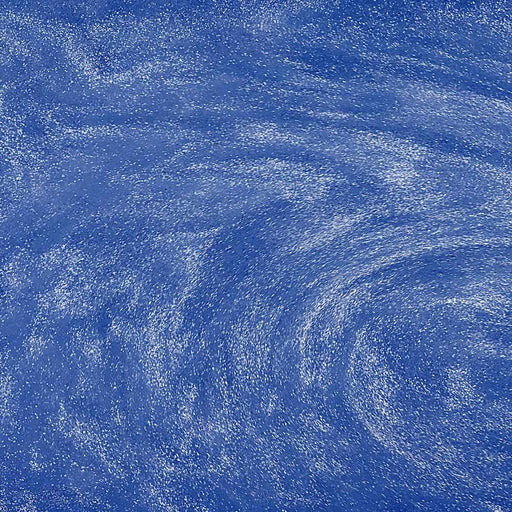 Swirling blue edible glitter particles suspended in a liquid, creating a shimmering, sparkling effect.