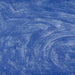 Swirling blue edible glitter particles suspended in a liquid, creating a shimmering, sparkling effect.
