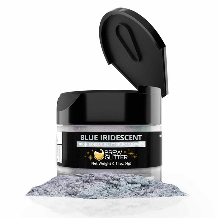 4g jar of blue iridescent edible drink glitter with a black flip-top lid and a pile of shimmering powder in front.