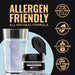 Blue iridescent edible drink glitter jar next to a shimmering blue glass, highlighting allergen-friendly, vegan features.