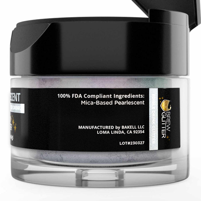 Small jar of blue iridescent edible Brew Glitter with a black lid and mica-based pearlescent powder label.