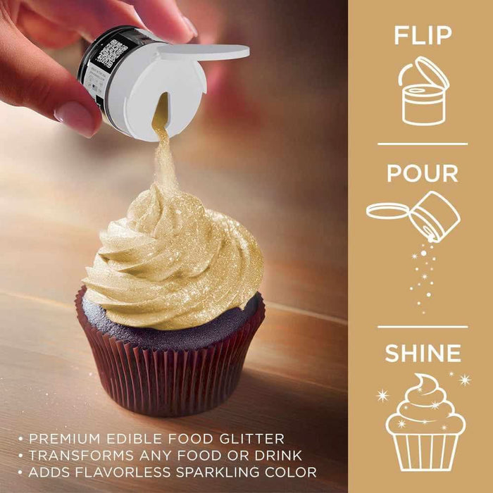 Hand sprinkling bright gold Tinker Dust edible glitter from a shaker onto a frosted chocolate cupcake.