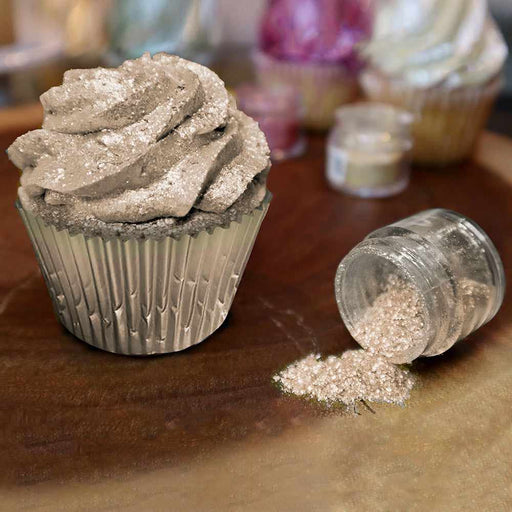 Front view of a cupcake covered in Brown Edible Glitter, with a jar of spilled  Brown edible glitter to the right of it. | bakell.com