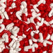 Red and white candy cane shaped sprinkles for holiday baking and cake decorating.