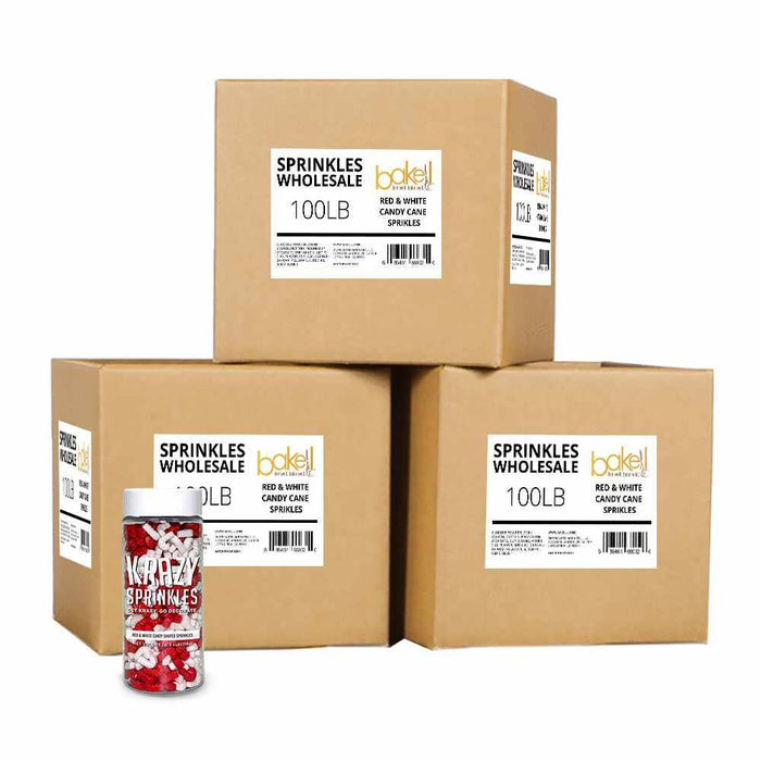 Three cardboard wholesale cases of red and white candy cane shaped sprinkles with a single retail jar.