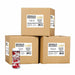 Three cardboard wholesale cases of red and white candy cane shaped sprinkles with a single retail jar.