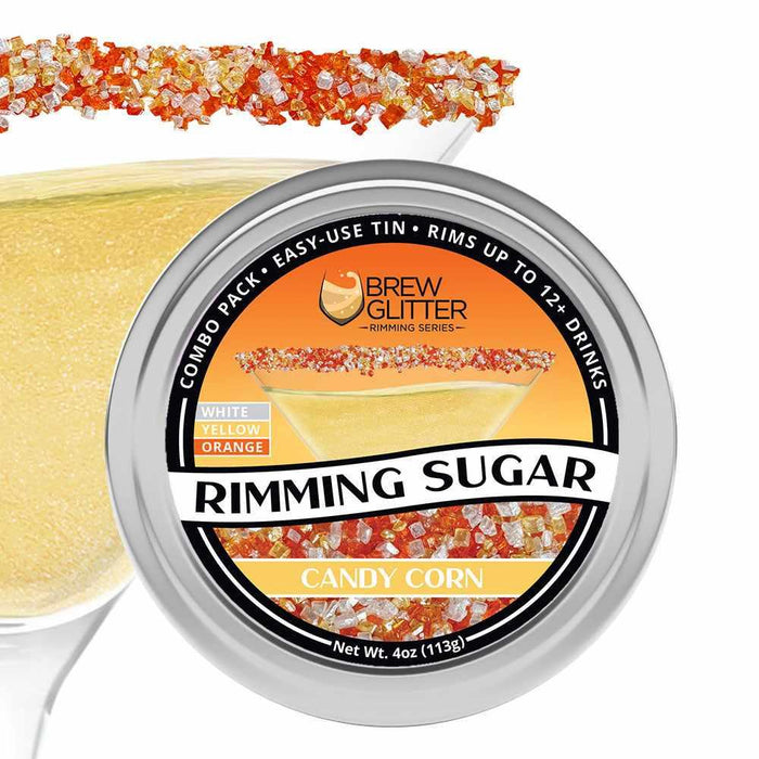 Candy Corn Rimming Sugar in an easy-use tin, shown on a cocktail glass with white, yellow, and orange sugar.