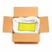Open cardboard box with a white bag containing 132lb of bright citrus yellow ultrafine UV reactive iridescent glitter.