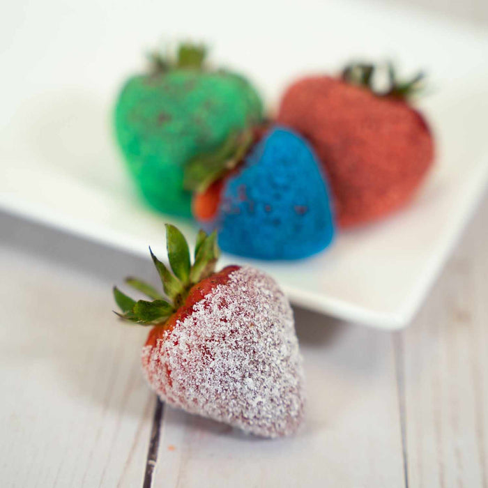 strawberries coated in sour sugar candy toppings