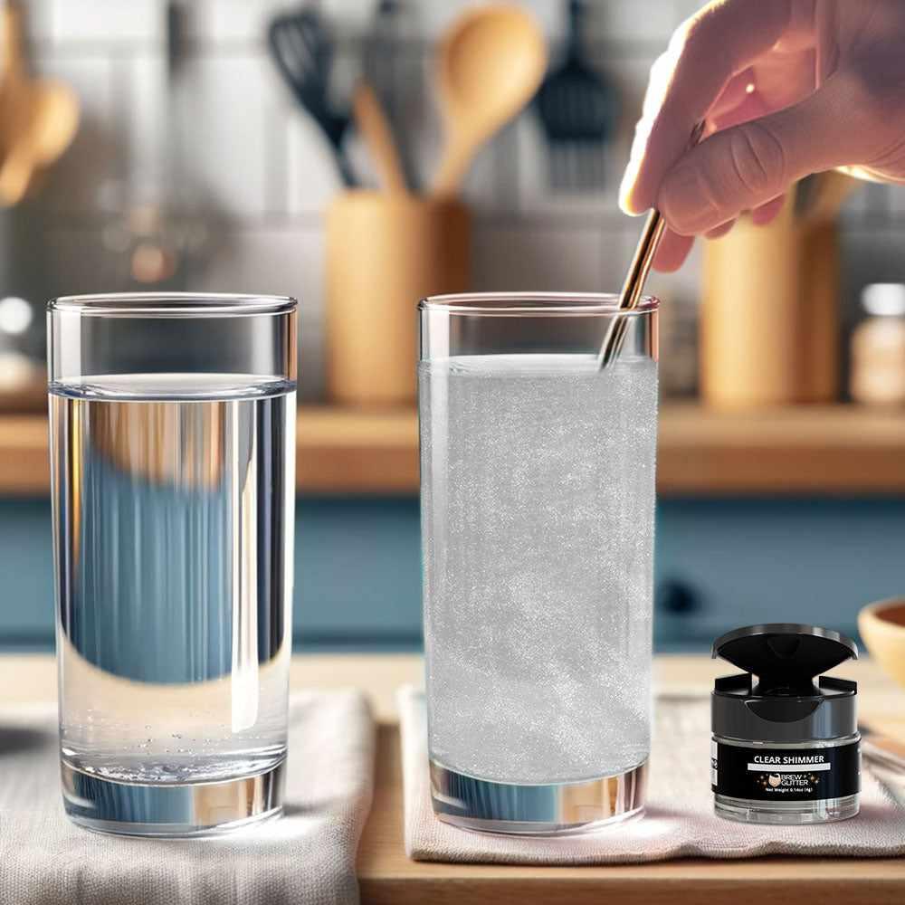 Clear shimmer edible glitter being stirred into a glass of water next to a 4g jar of Brew Glitter on a kitchen counter.