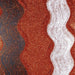 Copper Dazzler ultrafine metallic craft glitter with a wavy white glitter stripe on a dark background.