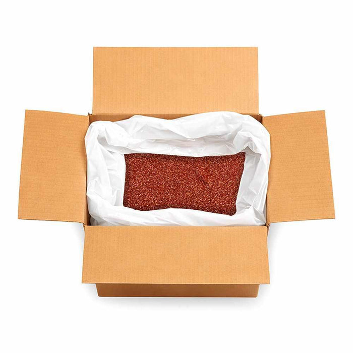 Open cardboard box filled with 132lb of bulk copper ultrafine metallic craft glitter in a white liner.