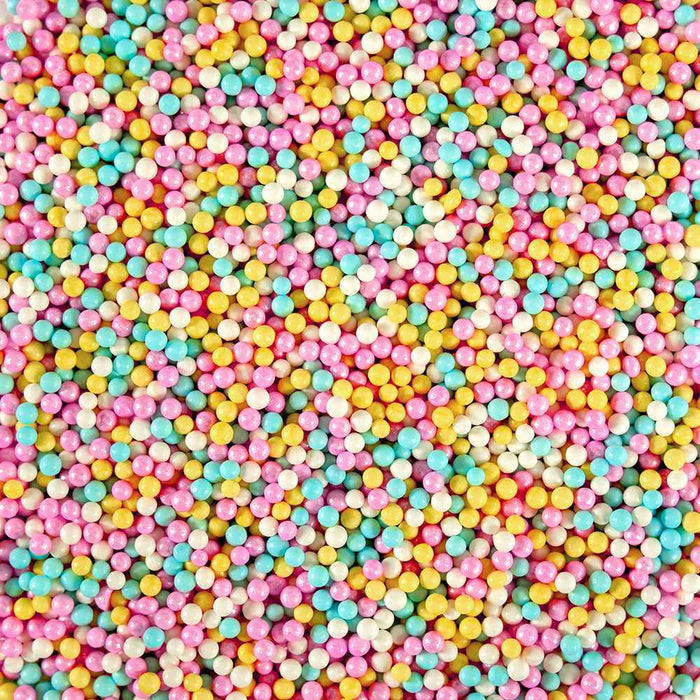 Cotton Candy Mini Sprinkle Beads: tiny round sprinkles in pink, blue, yellow, and white.