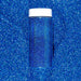 Deep Ocean Blue ultrafine holographic craft glitter in a clear jar with a white lid, on a sparkling blue background.