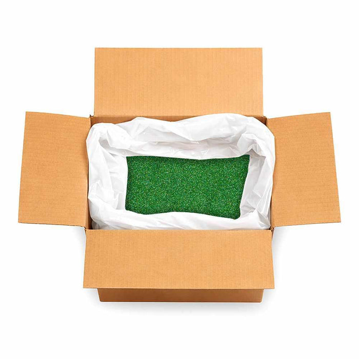 Open cardboard box filled with 132lb of emerald green ultrafine holographic craft glitter in a white liner.