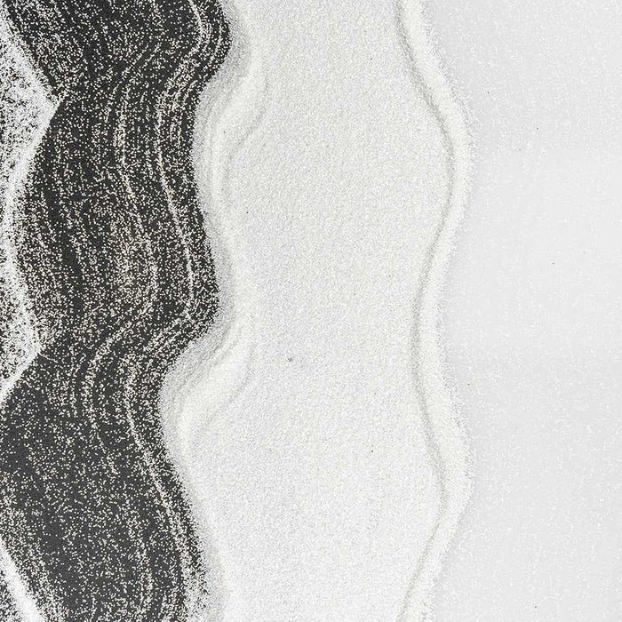 Ultrafine matte snow white UV reactive craft glitter in wavy patterns on a dark background.