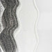 Ultrafine matte snow white UV reactive craft glitter in wavy patterns on a dark background.