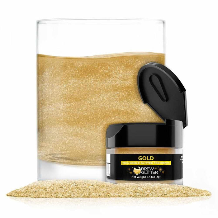Gold edible Brew Glitter in a 4g jar with an open lid, next to a glass of shimmering gold drink and a pile of glitter.