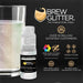 Gold Iridescent Brew Glitter mini spray pump next to a glass of shimmering drink.