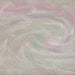 Swirling gold iridescent edible glitter with holographic rainbow highlights in a liquid base.
