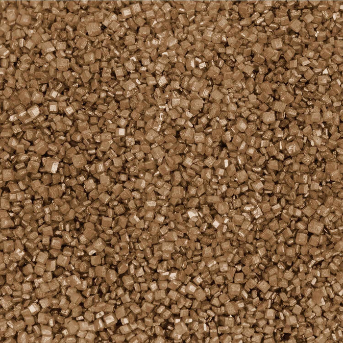 Close-up texture of shimmering gold pearl cocktail rimming sugar crystals for decorating glassware.