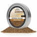 Round tin of Gold Pearl cocktail rimming sugar with a pile of shimmering brown sugar crystals in front.
