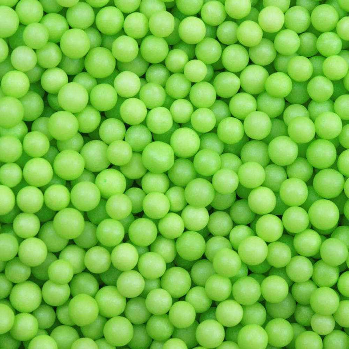 Close-up of numerous bright green 4mm sprinkle beads, ideal for wholesale.