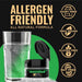 Green Color Changing Brew Glitter next to a glass of water, with allergen-friendly icons.