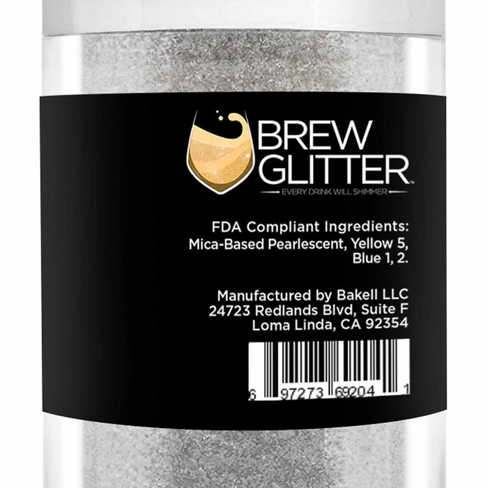 Clear jar of white Green Color Changing Brew Glitter with a black label showing the logo and ingredients.
