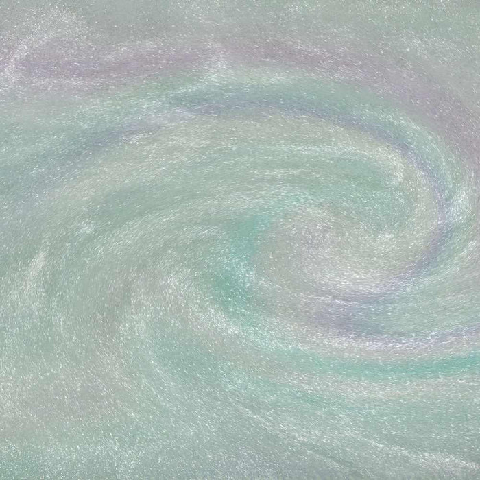 Swirling green iridescent edible glitter with holographic rainbow highlights for beverages.